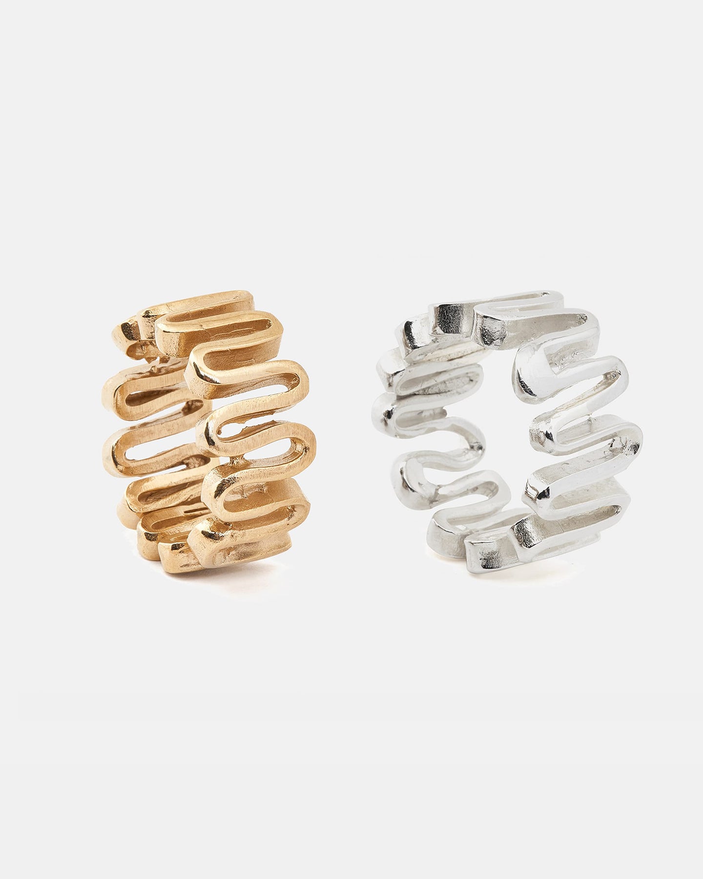 LMJ Arpa rings in silver and goldplated silver on a white background