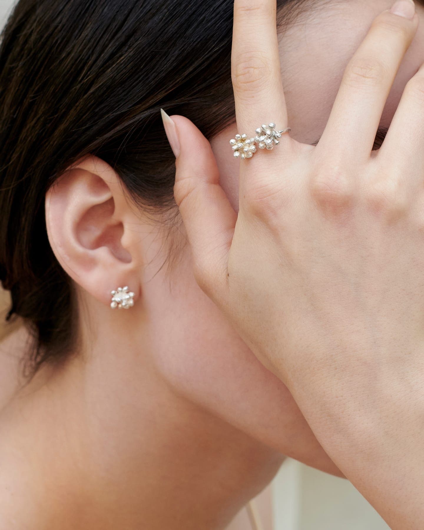 Model wearing LMJ Bouquet Ring in silver with matching earrings
