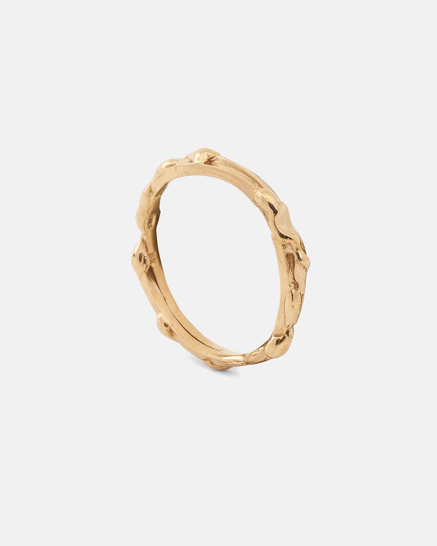 Gold drop ring with organic details, horizontal front view.