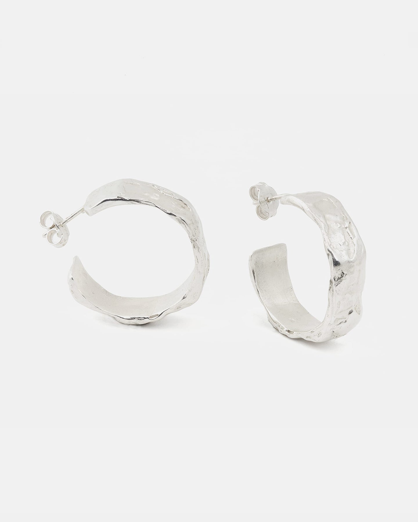 LMJ hand-sculpted ring in silver on a white background