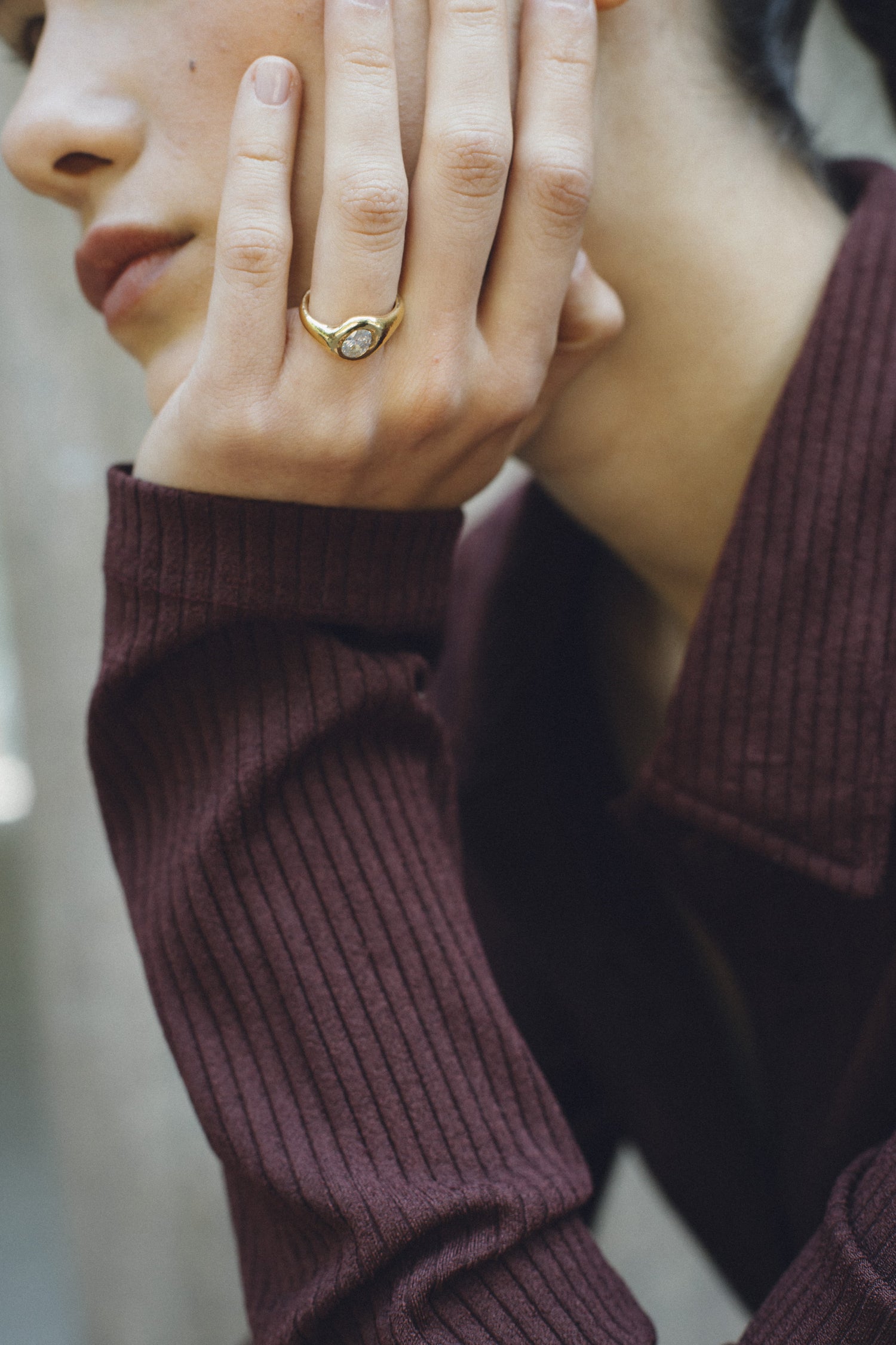 Orbit Maxi Ring worn on a hand, 18k gold engagement ring with an oval diamond