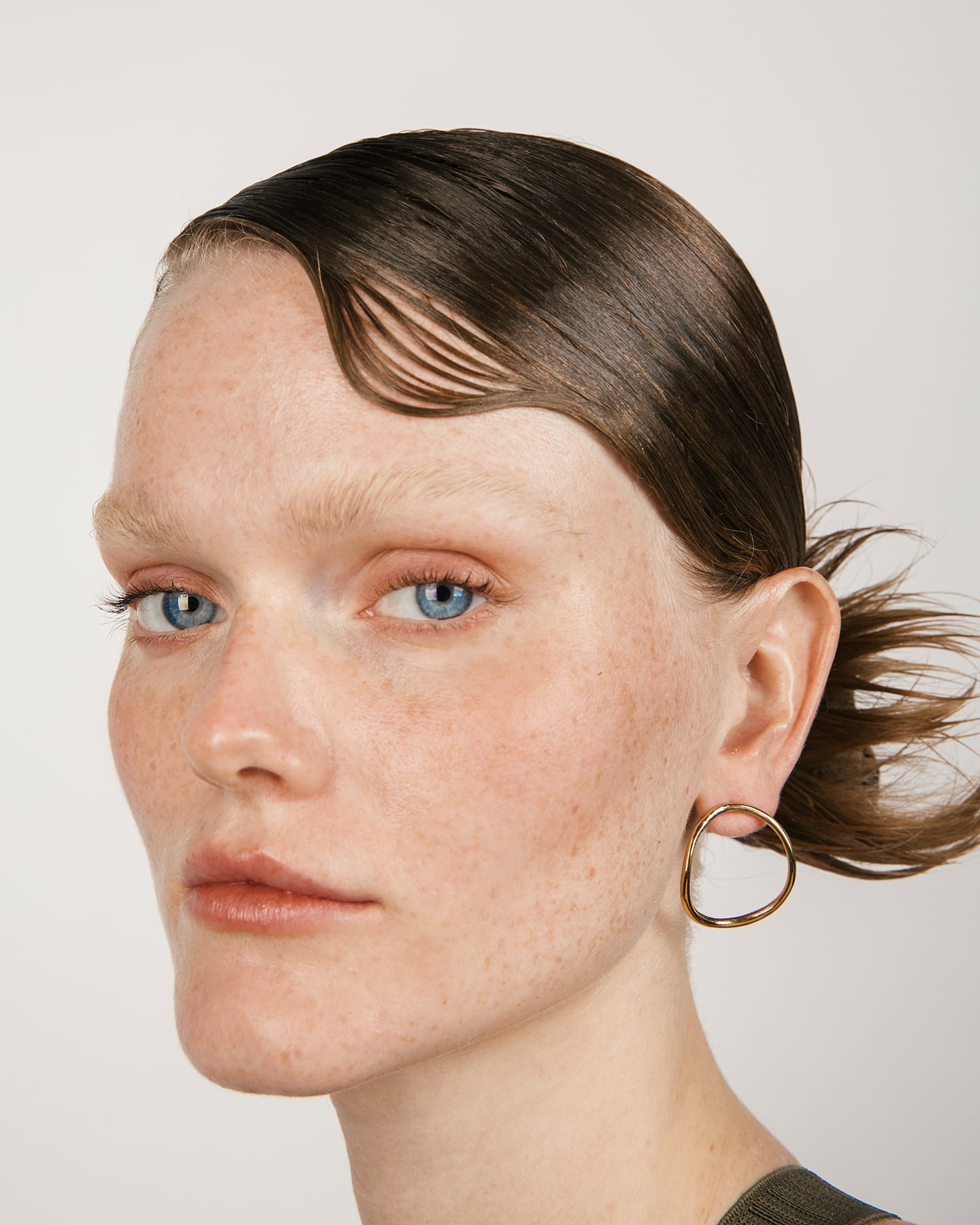 LMJ handmade Hollow Earrings in gold finish worn by a model