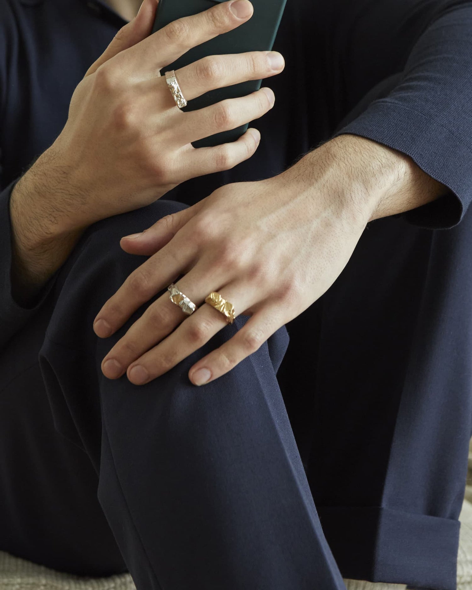 Latemar and Lunar rings worn by a male model