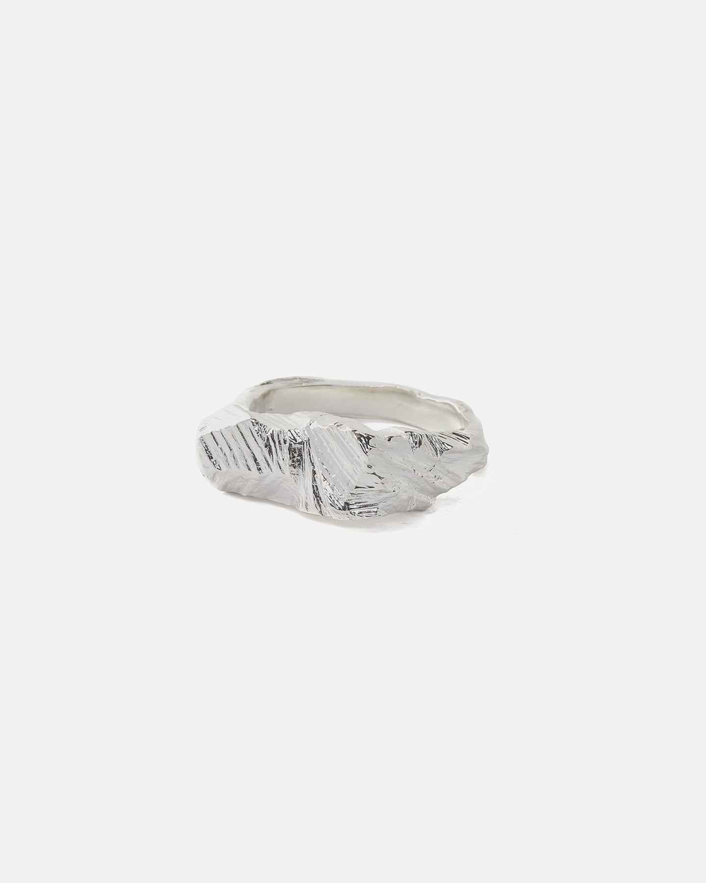 Latemar ring in silver with chiseled architectural surface, front view.
