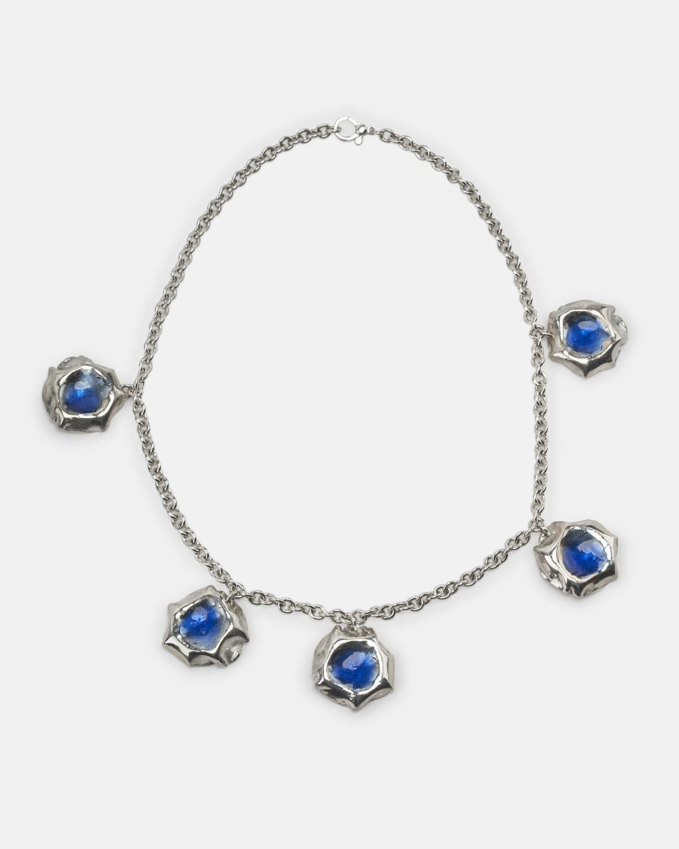 LMJ Puff Necklace in silver with blue enamel charms, laid flat