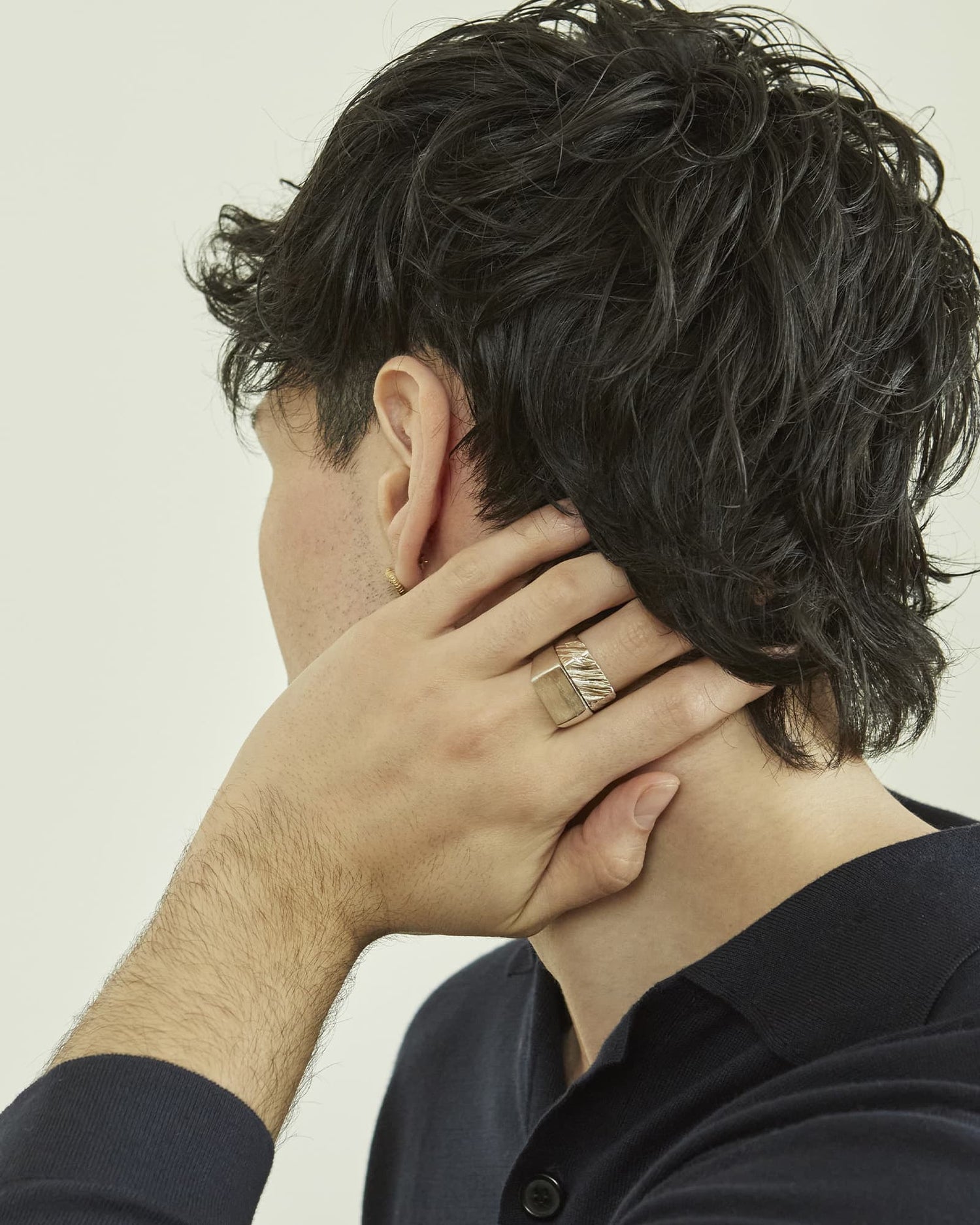 LMJ Silver ring with a textured design worn by a model 