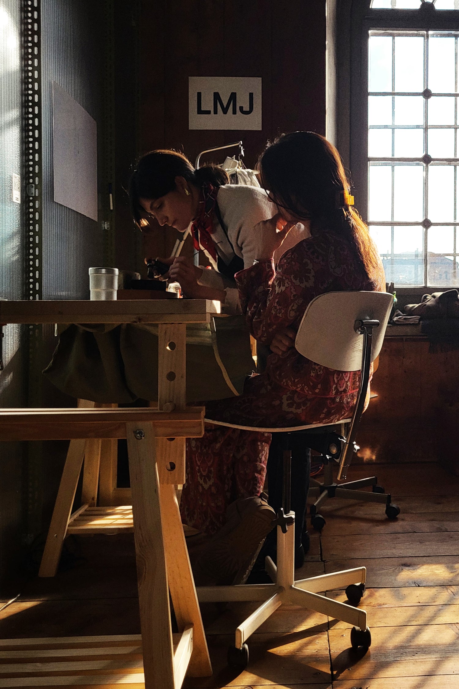 Laura and a student during one of the LMJ Jewelry Making workshops.